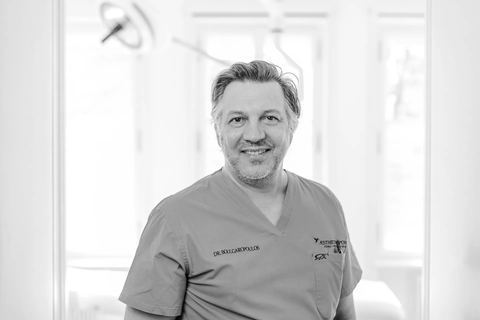 Dr. Victor Boulgaropoulos in scrubs at the practice in Vienna